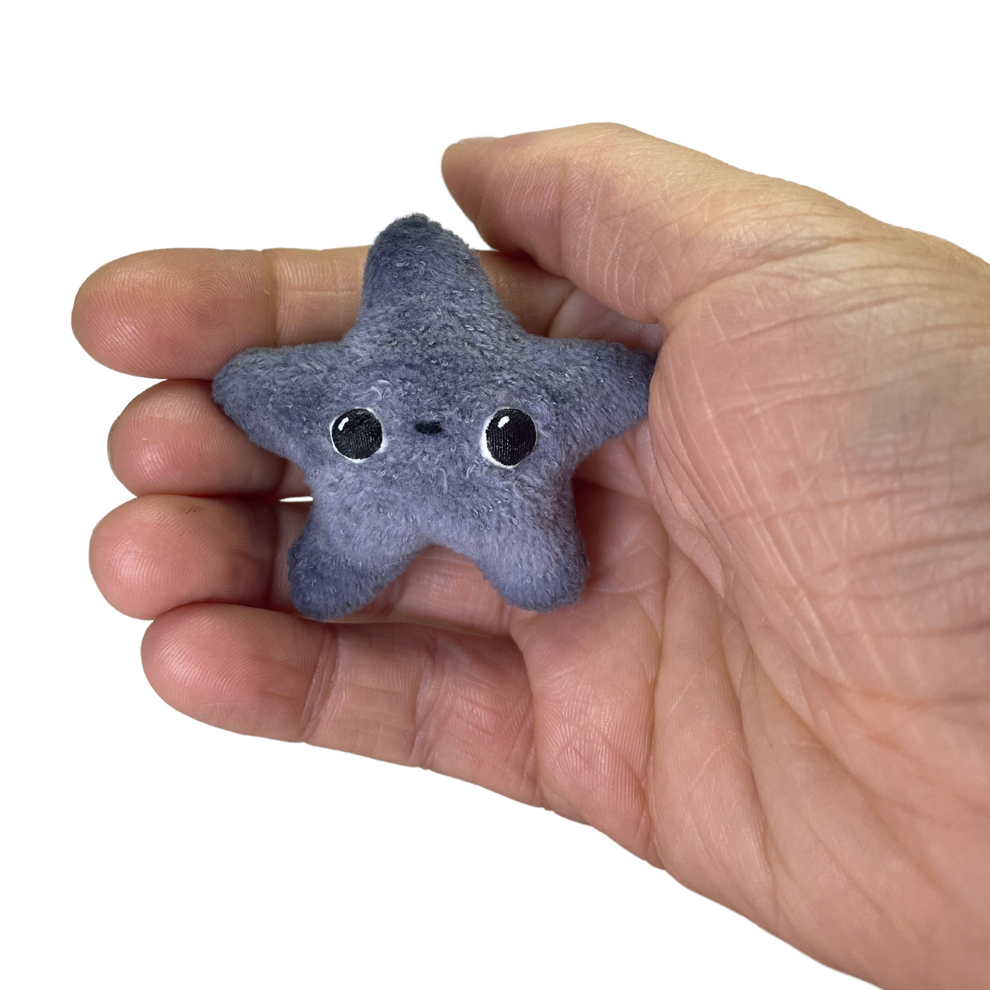 twinkling tiny gray star plushie